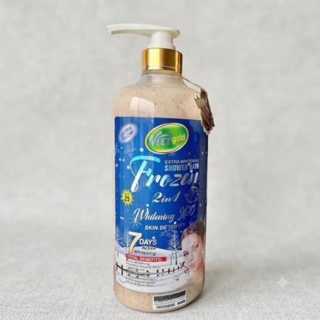 A high-resolution product image of Veet Gold Extra Whitening Frozen 2-in-1 Shower Bath and Skin Detoxify gel in a large pump bottle with gold accents, featuring its distinct blue snow-themed label, set against a soft grey texture background.